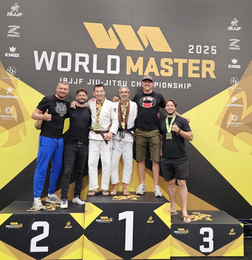Professor Robbie gets black belt on the Podium