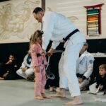 Young girl Achieving the Gray belt in jujitsu